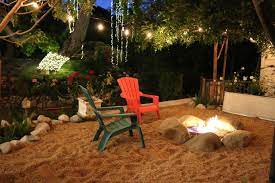 Backyard Sand Hanging Lights Rocks Boulders Plants Trees Flowers Beach Chairs Fire Pit Landsca Landscape Services Cool Fire Pits Outdoor Fire Pit