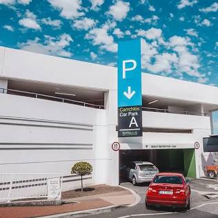 Multi-storey airport terminal car park, AI generated