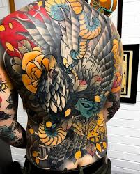 A bald eagle tattoo is a patriotic symbol, and is often accompanied by an american flag. Japanese Inspired Neo Traditional Back Tattoo By Sneakymitch Japaneseink Japanesetattoo Irezum Japanese Back Tattoo Traditional Back Tattoo Japanese Tattoo