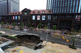 chinese road engulfed by giant sinkhole