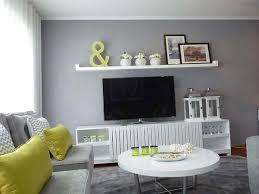 It still gives off a serene feeling even though the colours have contrasting brightness. Green And Grey Living Room Design