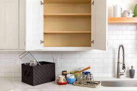 The upper cabinet to the left of our stove is my baking cabinet. How To Organize Kitchen Cabinets