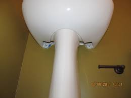 up on a pedestal (sink) with the