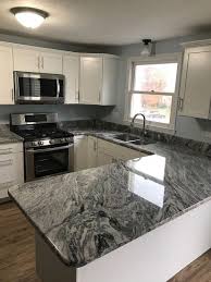 Large center island in kitchen with seating facing the cooking and prep area. Pin By Emily Mcfarlane On Kitchen In 2020 Granite Countertops Kitchen Replacing Kitchen Countertops Outdoor Kitchen Countertops