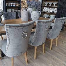 landelijke eettafelstoel lily velours grijs met zilveren ring en zilveren studs woonkamerbank eettafel stoel huisdesign