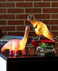 add some prehistoric fun to your room s decor with this dinosaur table lamp the dinosaur s realistic look makes it an int dinosaur lamp dinosaur dinosaur room
