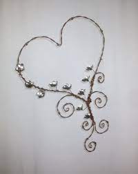 Barbed Wire Heart With Wee Red Forever Blooming Flowers Made Etsy In 2021 Barbed Wire Art Wire Hanger Crafts Copper Wire Art