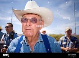 Arizona cattle rancher John Ladd stands