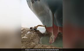 Boats and container ship beside cranes at the suez canal (reuters). Nxmygcy1viv1m