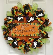 Wreaths are a way to say, welcome, even if it's a spooky one. The Holiday Aisle Happy Halloween Argyle 24 Deco Mesh Wreath Wayfair