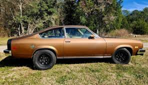 Image result for Dark Yellow 1976 Vega