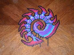 An attractive traditional sampler with diamond motifs in different sizes and all the letters of the alphabet. Starcraft Zerg Symbol By Magnus8907 On Deviantart Perler Bead Art Perler Beads Designs Perler Patterns