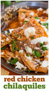 This Easy Chicken Chilaquiles Recipe Is Smothered In Refried Beans And Red Enchilada Easy Chilaquiles Recipe Chicken Chilaquiles Mexican Food Recipes Authentic