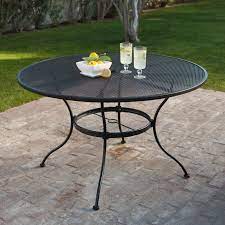 Have To Have It Woodard Stanton 48 In Round Wrought Iron Patio Dining Table Textured Blac Round Patio Table Wrought Iron Patio Furniture Wrought Iron Table