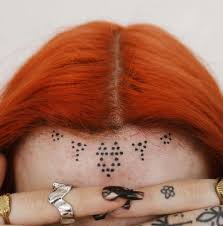 Image result for quirky pylon forehead tattoo