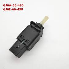 The brake light switch is located under the dash, attached to a bracket that is positioned to allow the switch to contact the brake pedal arm. 4 Pins Car Brake Light Switch For Mazda 6 Gg Mazda Cx 7 Mazda Mx5 Nc Brake Pedal Switch Gj6e 66 490 Gj6e66490 Gj6a 66 490 Sensors Switches Aliexpress