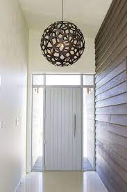 Interior Weatherboard Bringing The Outside In Through This Entry Paired With A Striking Light Fixtu Entryway Light Fixtures House Entrance Entry Light Fixture