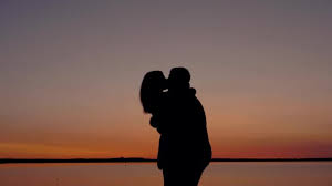 Ever you played kiss game. Silhouette Of A Loving Couple Men And Women Kissing And Cuddling At Sunset Video By C Dmitriilog Stock Footage 225855544