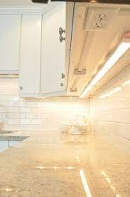 Kitchen with hidden under cabinet outlets. Under Cabinet Power Outlets Design Ideas