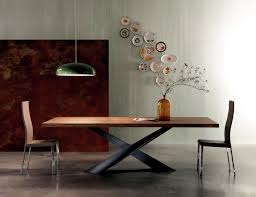 Winchester is a dining table that features a tubular conic structure supported by three legs, produced in polished brass and wood composite, finished with a glossy black color. Contemporary Wooden Table Table Base Raw Steel Interior Design Ideas Ofdesign