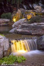 Backyard Waterfall With Lighting At Night Backyardideas Pond Waterfall Lighting Landscapedesi Waterfalls Backyard Backyard Lighting Backyard Water Feature