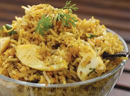 How To Make Egg Biryani A Fluffy Omelette Adds Another Layer To This Delicious Boiled Egg Biryani Biryani Vegetarian Menu Indian Food Recipes