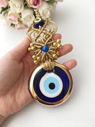Blue Evil Eye Wall Hanging Gold Macrame Evil Eye Gold Evil Etsy Blue Evil Eye Eye Decor Evil Eye Tattoo
