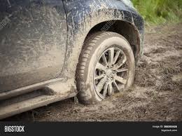 Finding that your car is stuck in the mud is trying at the best of times. Wheels Car Stuck Mud Image Photo Free Trial Bigstock