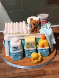 Blue changing bag cake that went out today for a baby shower. Carved from  vanilla sponge with jam and buttercream filling, all handmade and edible.