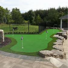 A Beautiful Five Hole Putting Green Completes This Rural Property Perfect For Relaxing And Entertai Backyard Putting Green Green Backyard Indoor Putting Green