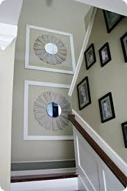 Also, avoid using large sized horizontal framed art as it'll not tend to work well! Diy Sunburst Mirror Staircase Wall Decor Staircase Decor Tall Wall Decor