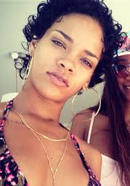 The medium length curly hair of rihanna tossed up in a puff and spread around the face lends a. Pictures Rihanna S Short Haircuts Best Styles Over The Years Rihanna Short Curly Hairstyle