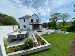 We've seen a move away from solid pavements and a favour towards cut out pavers lining pathways, interspersed with round stones. Design Ideas For A Large Patio Marshalls