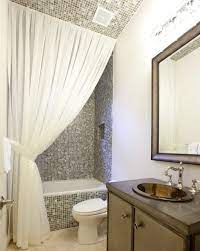 The bathroom window and shower curtains can bring a lot of character to a bathroom. Making Your Bathroom Look Larger With Shower Curtain Ideas