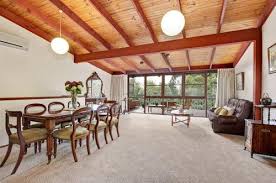 White ceiling beams make this kitchen feel extra bright and open. Should We Paint The Dark Wood Ceiling Beams White