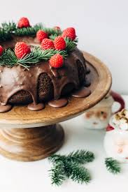 A bundt cake makes any cake more festive, as do floral and ribbon touches. Chocolate Raspberry Red Wine Wreath Bundt Cake Christmas Cake Designs Christmas Baking Christmas Cake Decorations