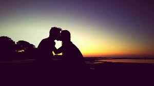 Romantic couple holding hands on beach at sunset with amazing light and colors. 125621 Romantic Couple Kiss Sunset Mocah Hd Wallpapers