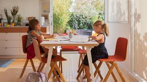 An extendable table, decorative lighting and comfy seating help create a welcoming dining room where friends and family feel at home. Floyd Home Tables