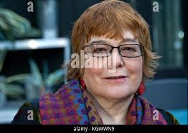 Gardening writer Anne Wareham in her conservatory, at her home in Devauden,  Monmouthsire Stock Photo
