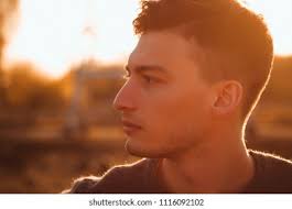 Young Man Playing Harmonica On Beach Stock Photo 567908977
