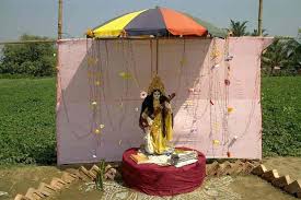 Artist decorate a puja pandal during dussehra festival celebration. A Village Saraswati Puja With A Difference