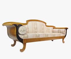 This sofa has a wooden frame and an upholstered seat, backrest, and armrests. Biedermeier Sofa Birke Antik Acente