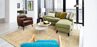 By placing two facing sofas in the living area, this layout instantly takes on a more formal look while keeping the flow of the room open. Living Room Design Ideas On A Budget Cort Furniture Outlet