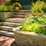 How to landscape with rocks on a steep slope. Dealing With Sloping Lawns Tips For Growing Grass On A Slope