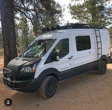 Ford Transit Outfitted With Aluminess Front Light Bar Roof Rack And Ladder Ford Transit Camper Ford Transit Ford Transit Campervan
