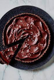 This Salted Caramel Chocolate Tart Tastes Like A Sophisticated Milk Dud Chocolate Tart Dark Chocolate Desserts Salted Caramel Chocolate Tart