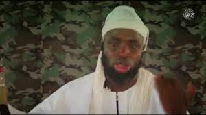 Dressed in fatigues, with a rifle slung across his chest and masked men at his sides. Take Infidels Souls In Order To Purify The Land Shekau Urges Followers In New Video Sahara Reporters