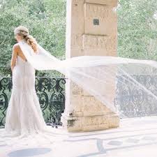 We Love The Cape On This Wedding Gown It Is Simply Ethereal Photography Erica J Photography Calligraphy Beach Bridal Bridal Cape Wedding Dress Inspiration