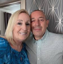 Where is the hand in the photo?