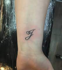 100 Initial Tattoos Perfect For Proclaiming Your Love For Your Partner Wrist Tattoos For Women Tattoos For Women Initial Wrist Tattoos